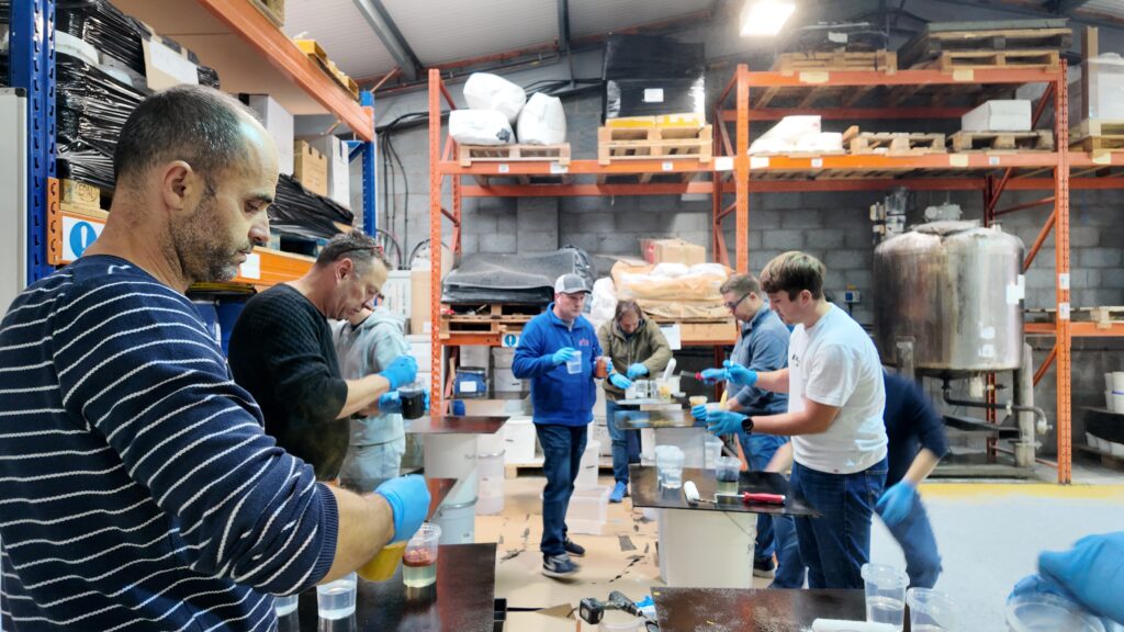 attendees of an optus training seminar getting hands-on experience with products