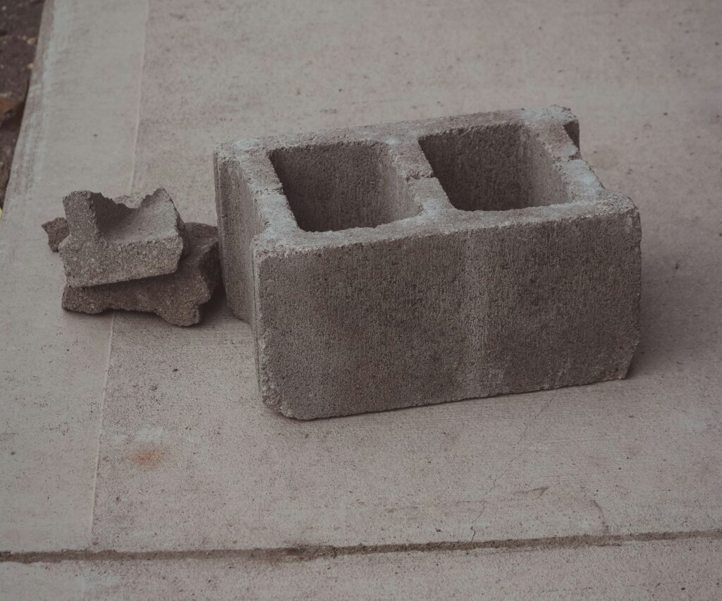 broken cinderblocks on a concrete surface
