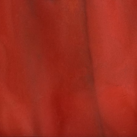 P1240 AMERICANA A. A textured, reddish-brown sample with subtle, darker vertical streaks. The color is not uniform, with some areas appearing slightly brighter or more orange-tinted, creating a soft, marbled effect.