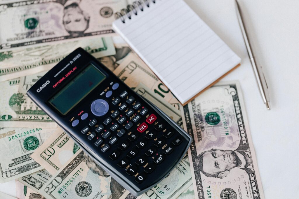 cash, calculator, notepad