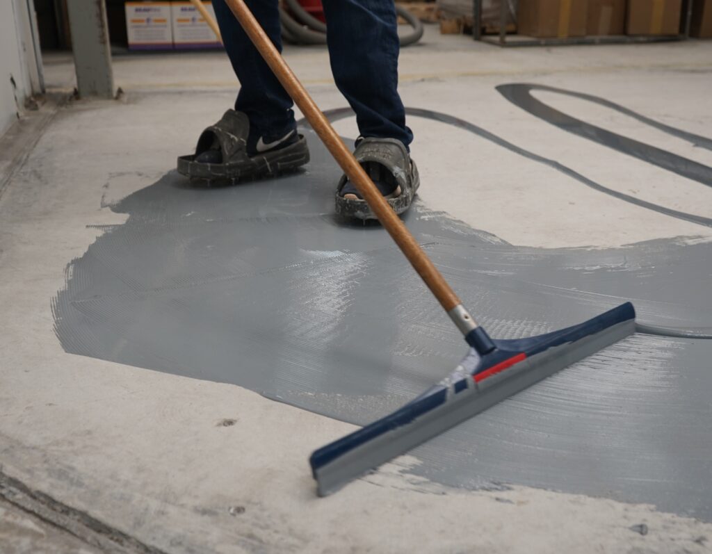 applying an epoxy coating to a floor