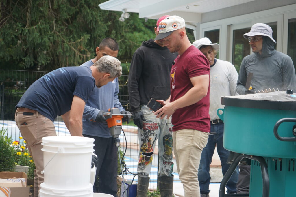 a team of installers standing around equipment
