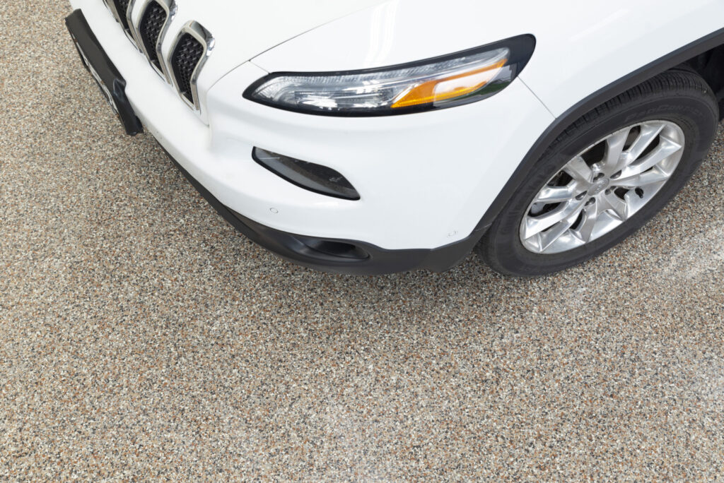 a white car on top of a simulated terrazo floor