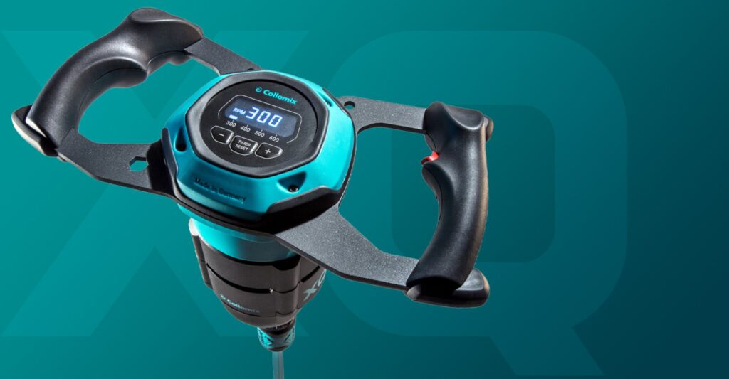 A close-up product shot of a teal and black Collomix XQ series handheld power mixer against a dark teal background featuring a large, subtle "XQ" graphic.